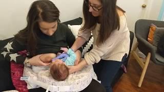 Breastfeeding latch lip tapping technique