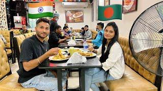 Indian boy having lunch with Bangladeshi girl