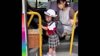 Little girl waiting for school bus in Japan