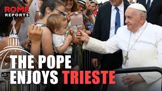 Pope Francis passes through Triestes central square in the popemobile