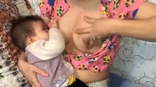 cute mom breastfeeding to baby 