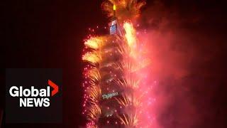 New Years 2024 Taiwans Taipei 101 lit up with dazzling fireworks