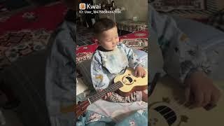 baby singing playing guitar
