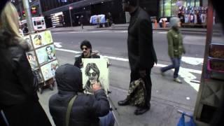 Banksy getting portrait drawn in Times Square NYC