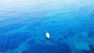 The Eva traditional Fishing Boat with captain Dimitris in Elounda Crete Greece 4K drone footage