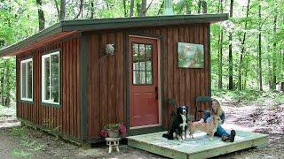 the off grid cabin building a porch and a fire pit