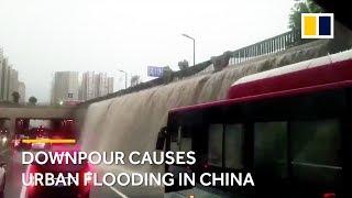 Downpour in China rains flood subway and halt commuters