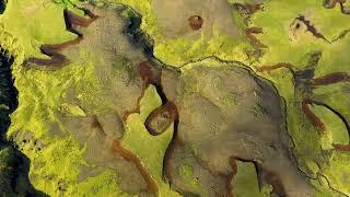 Aerial 4k drone view of the lava flows and green moss of  Eyjafjallajokull volcano in Iceland