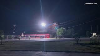 Electric power lines arc and create power flash in high winds