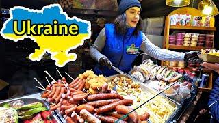  LVIV UKRAINE  STREET FOOD NIGHT MARKET AND NAUGHTY UKRAINIAN ANGELS AT NIGHT