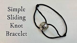 Simple adjustable sliding knot bracelet with a centre bead