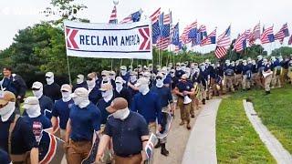 White supremacists march in Washington DC wearing masks