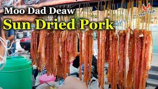 Dried pork is deep-fried on a moto cart. Sun Dried Pork  Street food in Thailand. Thai Taste