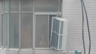 Chinese installing an aircon at 10th floor