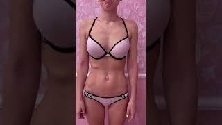 Girl flexing belly standing up in bra and panties 5