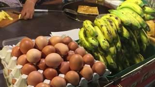 Thai Cute Girl Roasty Banana and Mango with Eggs-The Most Popular Street Food in Thailand