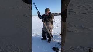 Ice spear fishing on a frozen lake #icefishing #darkhousespearing #winter