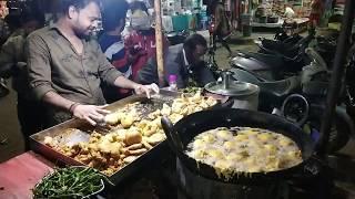 people enjoying popular Indian Street Food Aloo Bonda and Samosa 10 Rs for 2