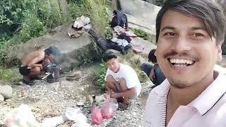 village cute boys eating picnic in riverside bank traditional eating lifestyle