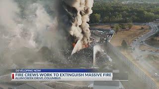 Fire crews work to extinguish massive fire in Columbus Ohio