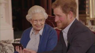 Queen Elizabeth II Prince Harry and a Smart Phone and a mike drop