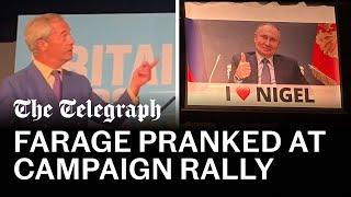 Nigel Farage pranked with Putin banner during speech